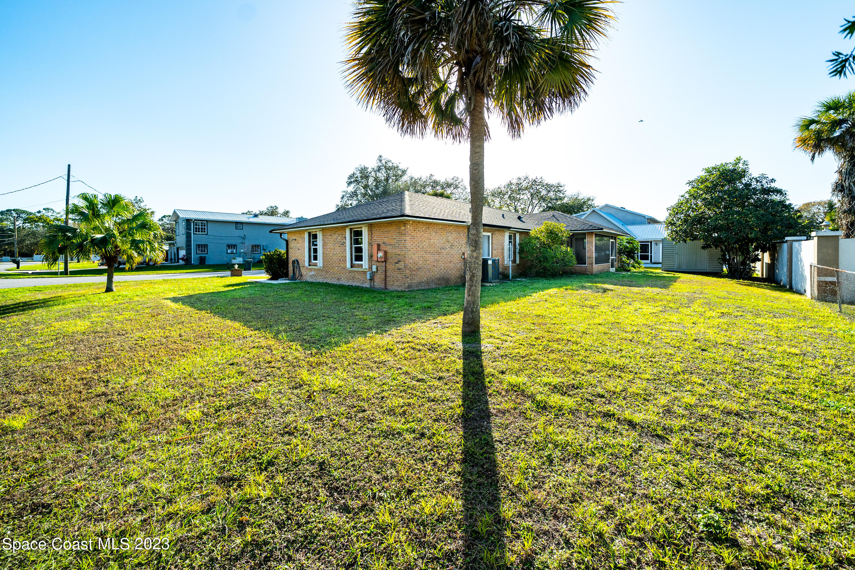 7746 Mango Grove Avenue Melbourne, FL 32904 - Photo 19 of 21 a view of swimming pool with a yard