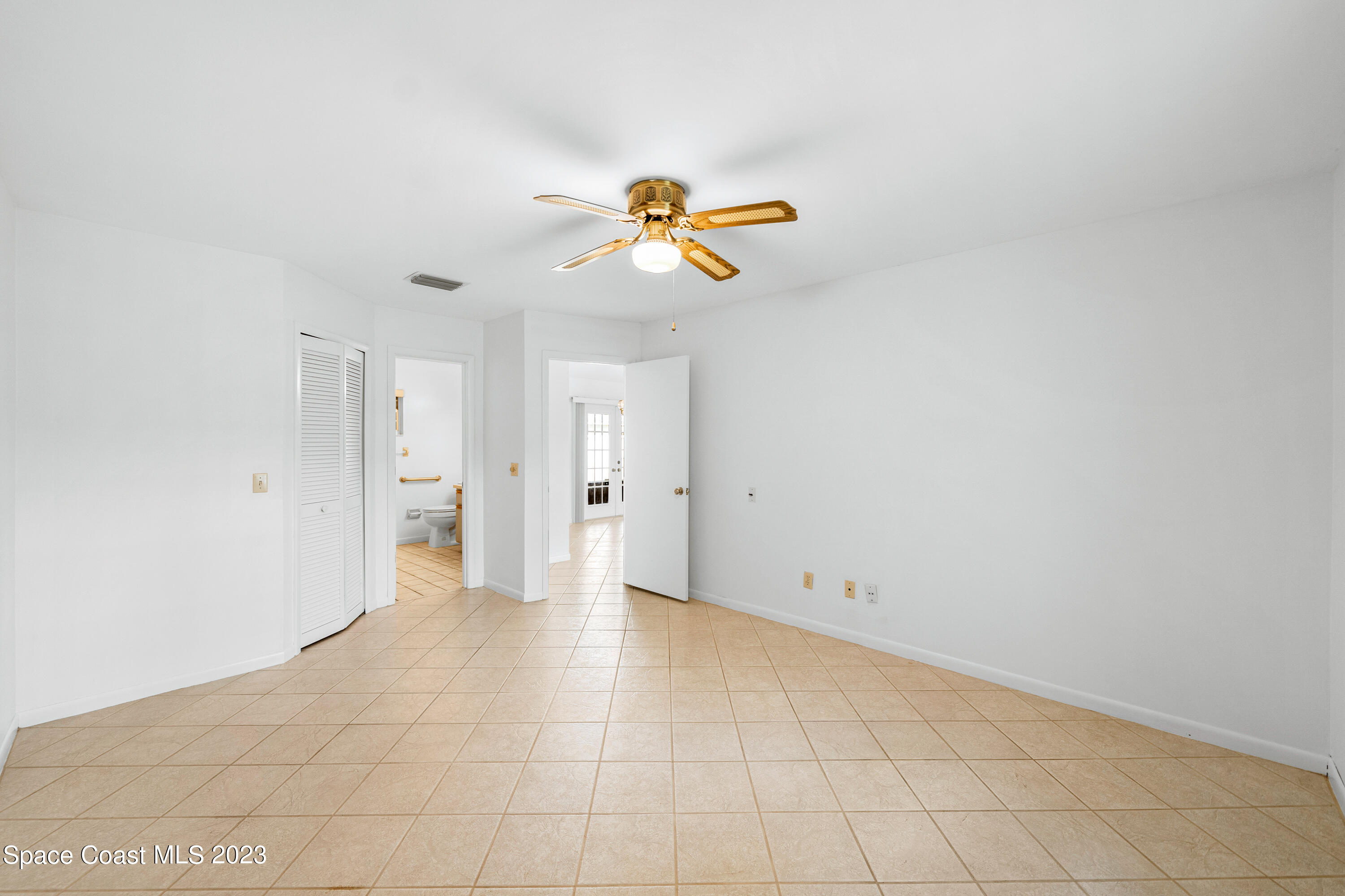 7746 Mango Grove Avenue Melbourne, FL 32904 - Photo 9 of 21 a view of an empty room