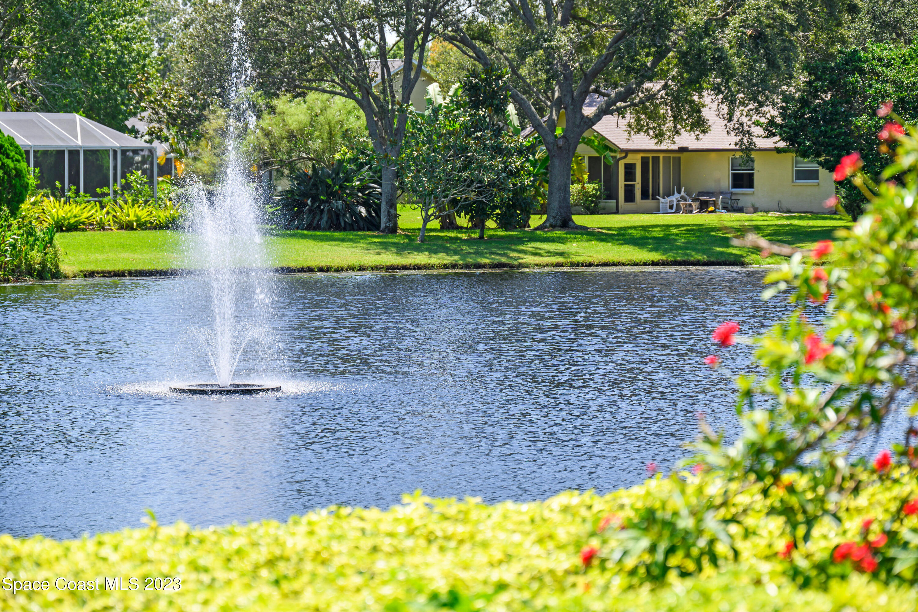 3360 Holly Springs Road Melbourne, FL 32934 - Photo 12 of 42 a front view of a house with garden