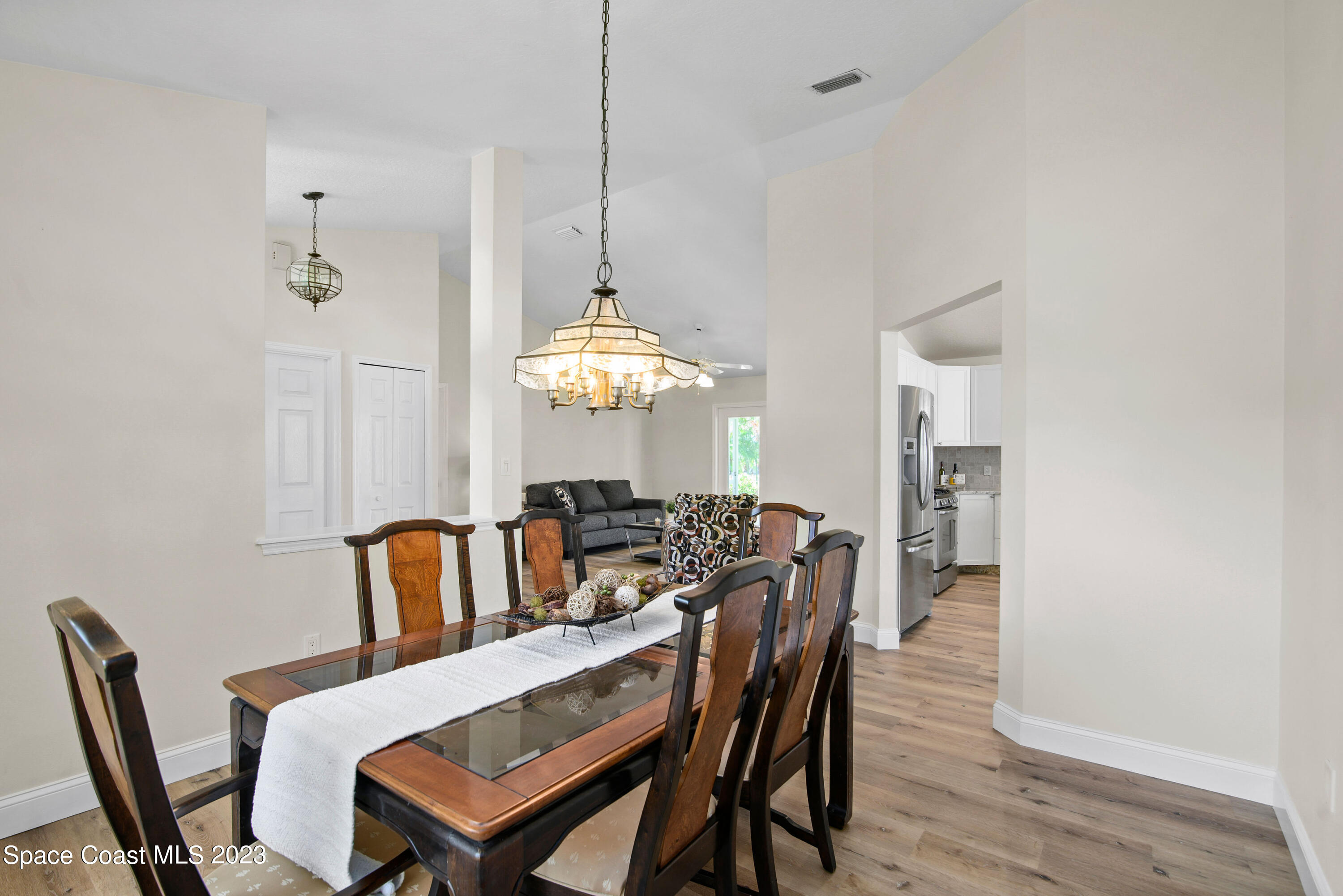 3360 Holly Springs Road Melbourne, FL 32934 - Photo 19 of 42 a view of a dining room with furniture