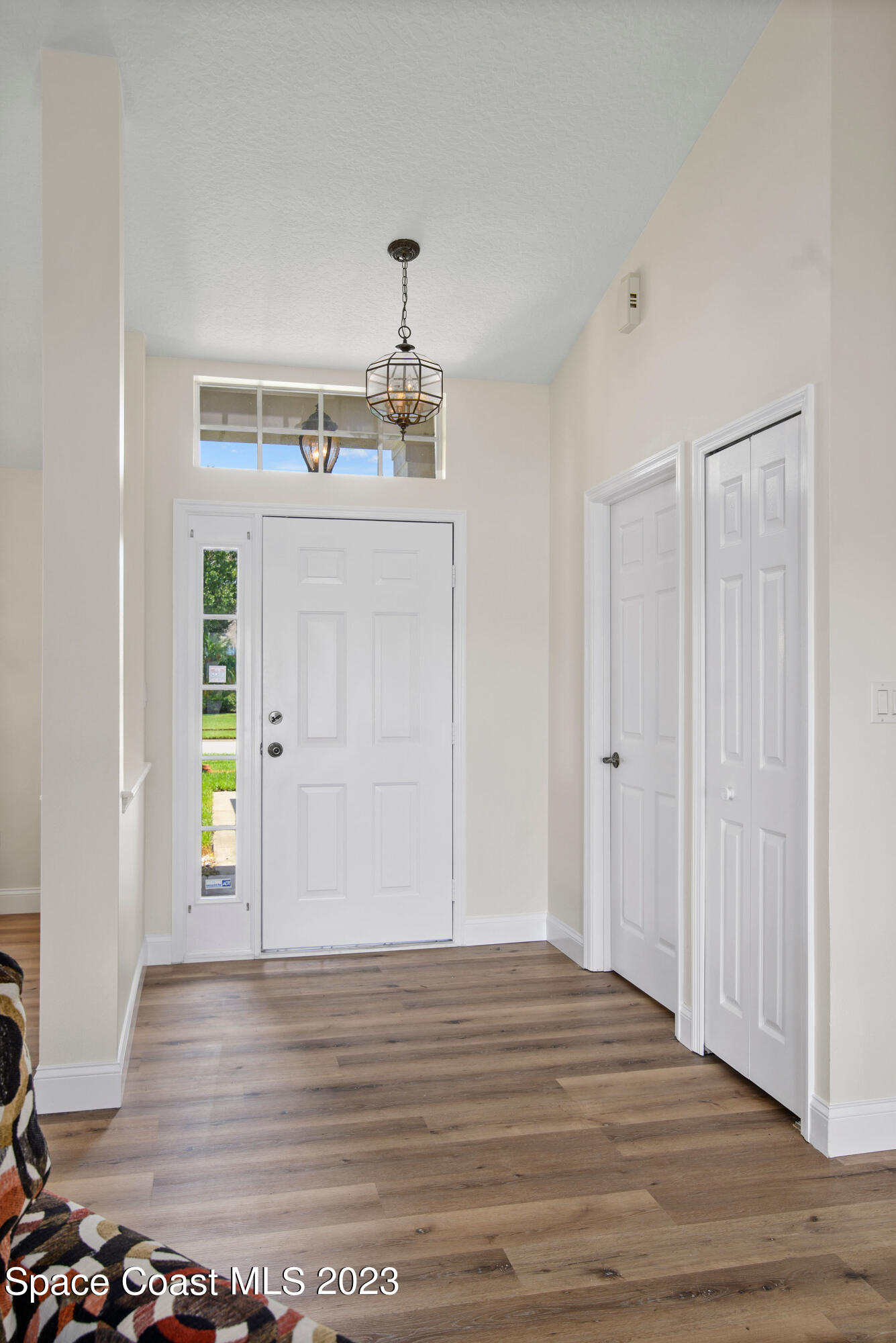 3360 Holly Springs Road Melbourne, FL 32934 - Photo 20 of 42 a view of a room with wooden floor and window