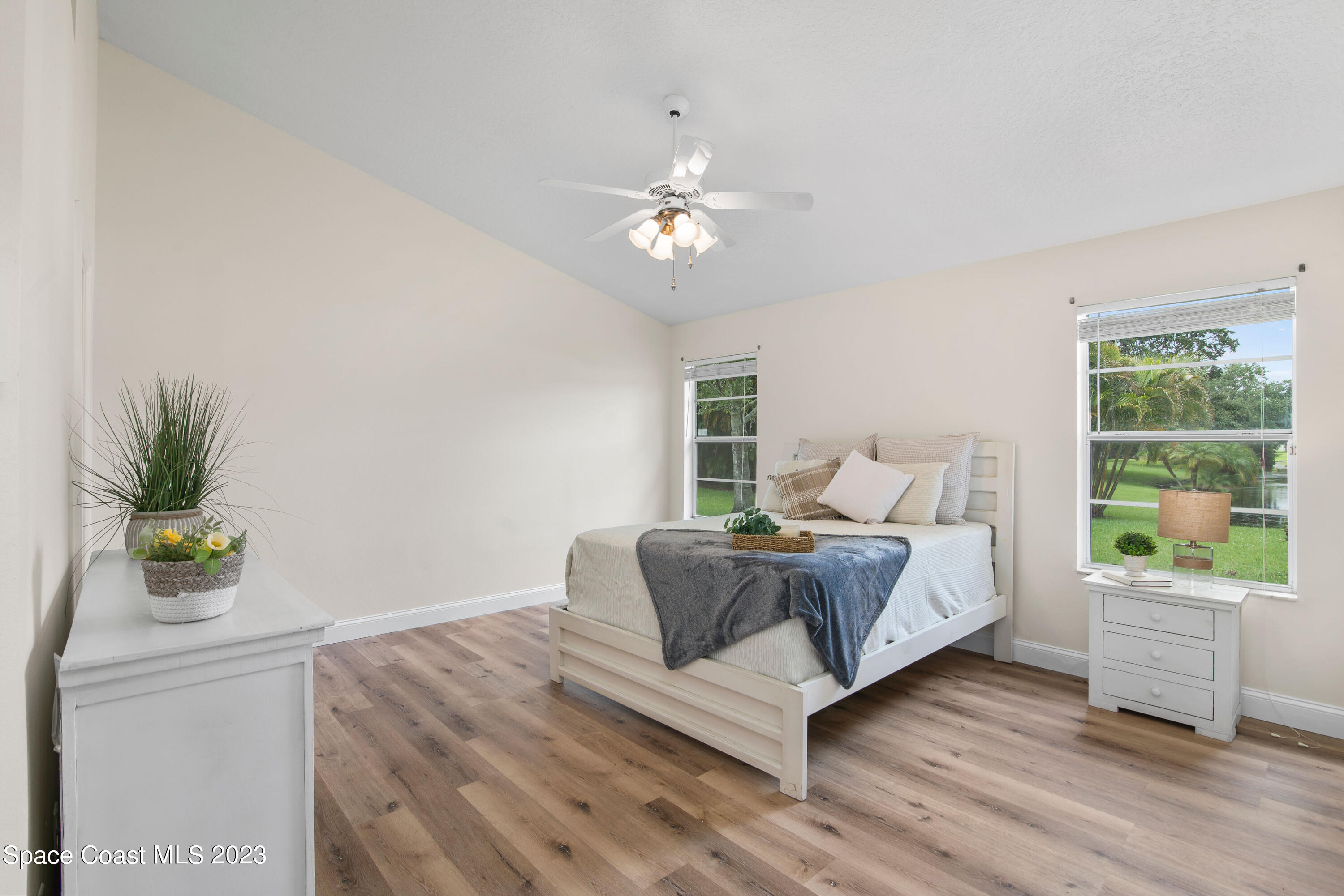 3360 Holly Springs Road Melbourne, FL 32934 - Photo 23 of 42 a bed room with a bed and a window