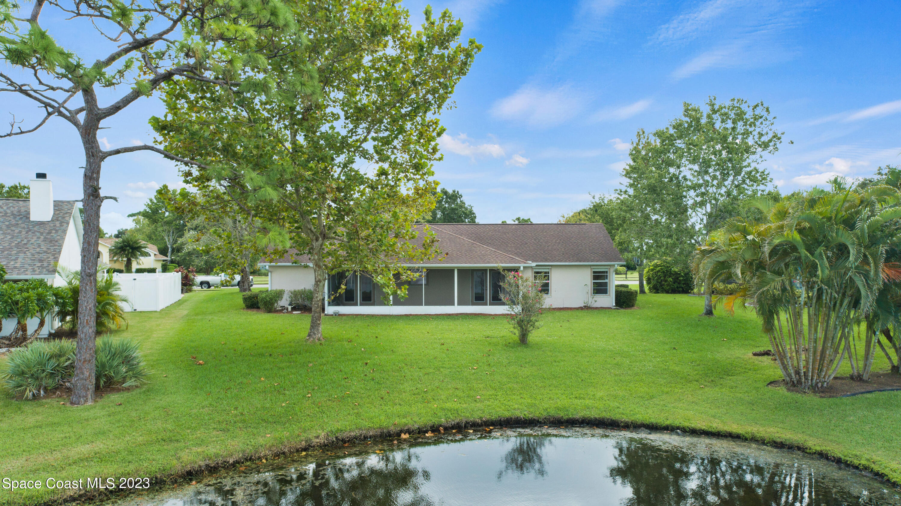 3360 Holly Springs Road Melbourne, FL 32934 - Photo 35 of 42 a view of a house with a backyard