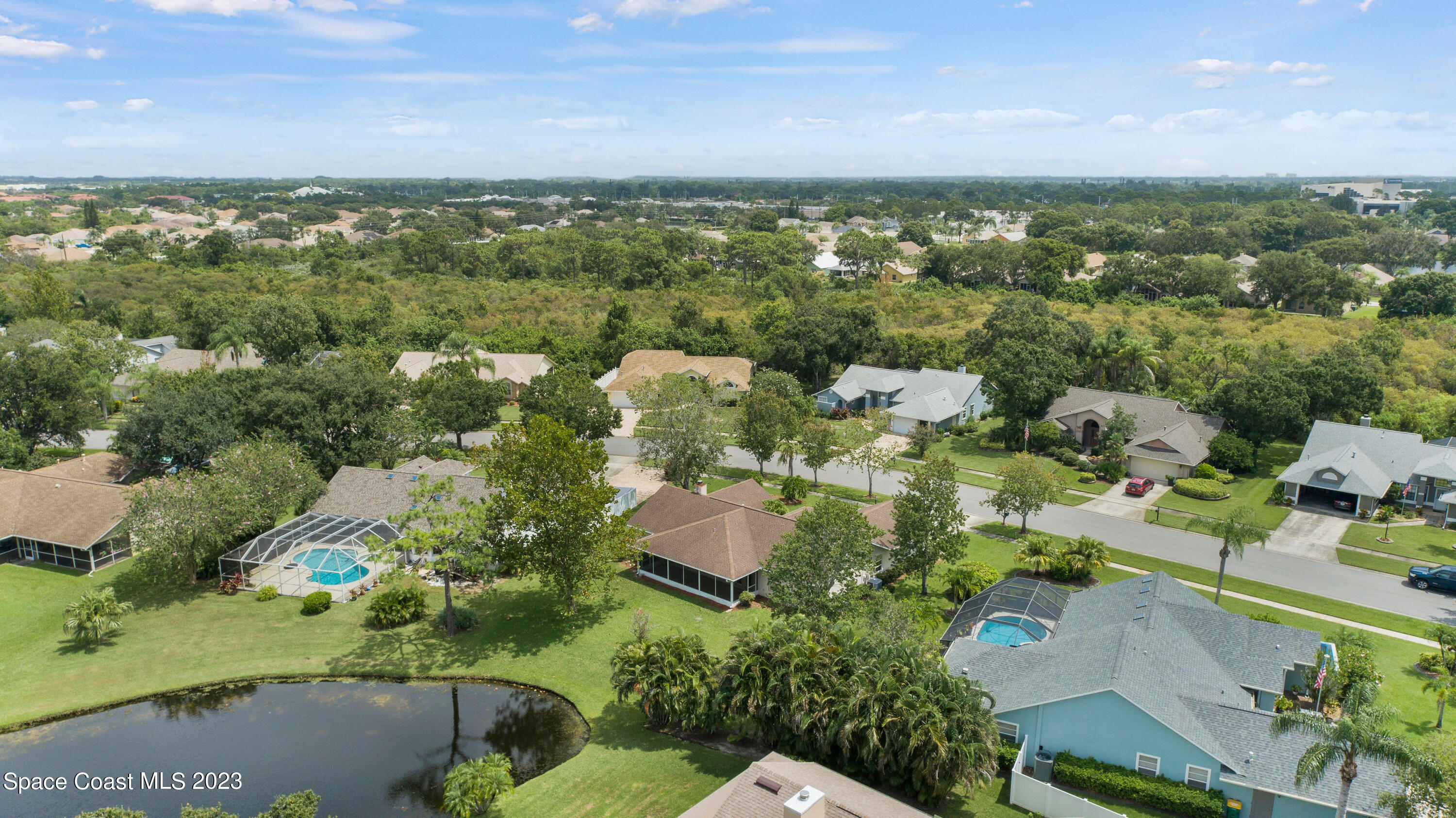 3360 Holly Springs Road Melbourne, FL 32934 - Photo 41 of 42 an aerial view of residential houses with outdoor space and trees