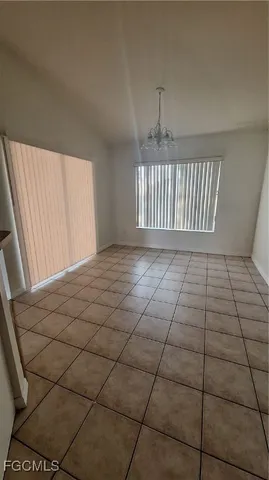 a view of an empty room and window