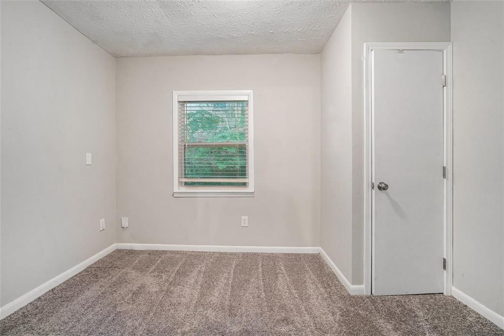 4442 Cedar Ridge Trail Stone Mountain, GA 30083 - Photo 11 of 15 an empty room with a window