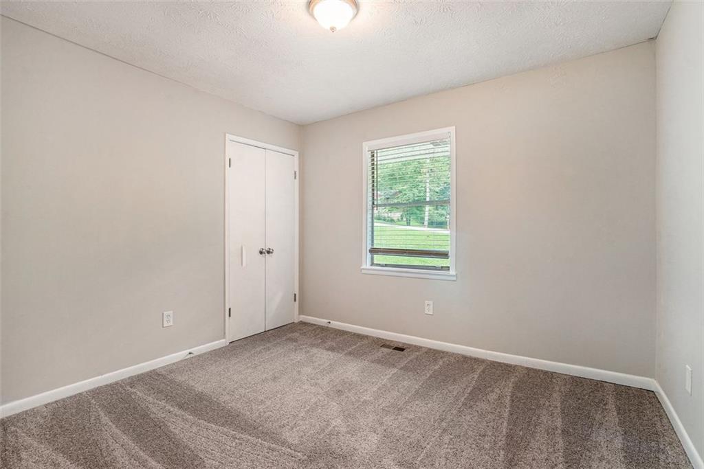 4442 Cedar Ridge Trail Stone Mountain, GA 30083 - Photo 12 of 15 an empty room with a window