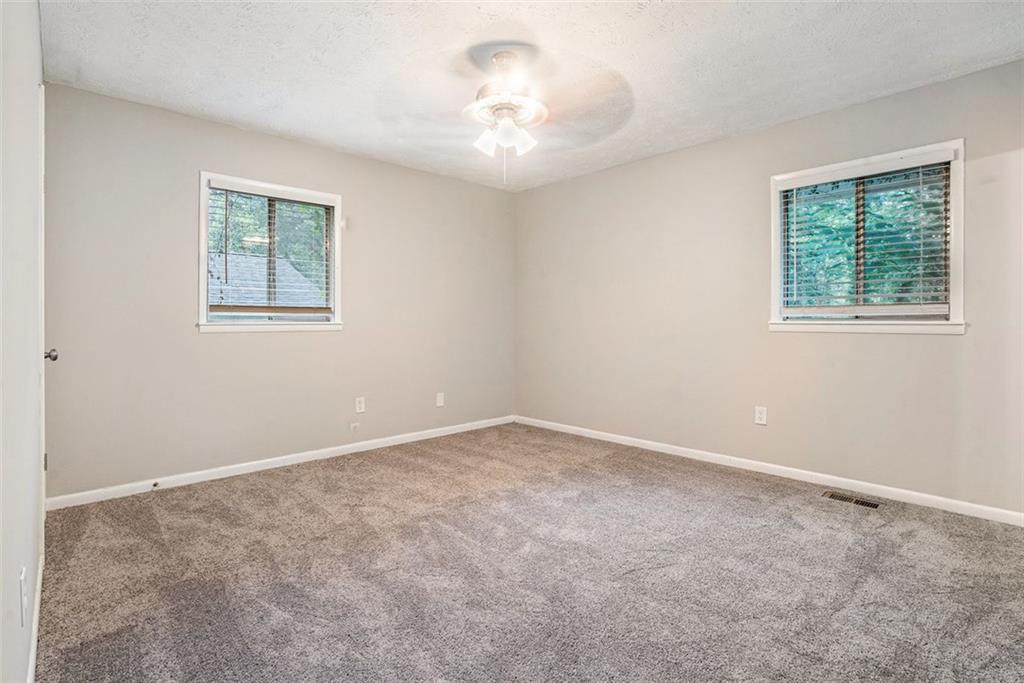 4442 Cedar Ridge Trail Stone Mountain, GA 30083 - Photo 7 of 15 an empty room with a window