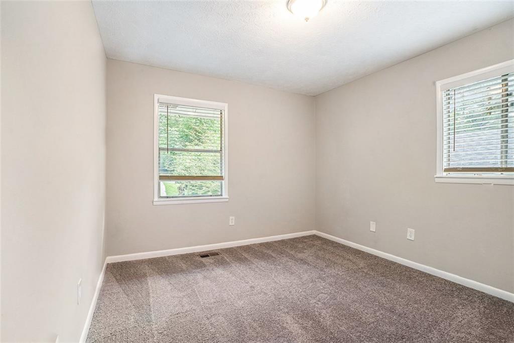 4442 Cedar Ridge Trail Stone Mountain, GA 30083 - Photo 10 of 15 an empty room with a window