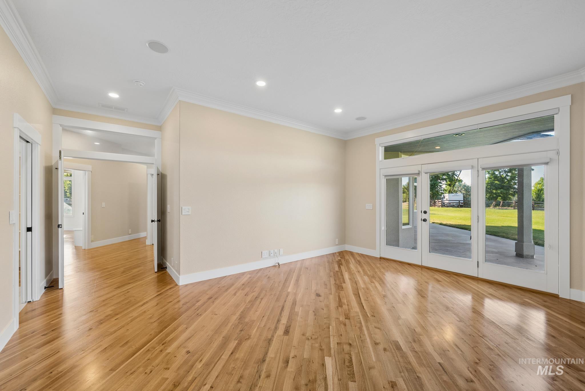 2050 Artesian Road Eagle, ID 83616 - Photo 23 of 49 Expansive room featuring wood-finish flooring, recessed lighting, and crown molding