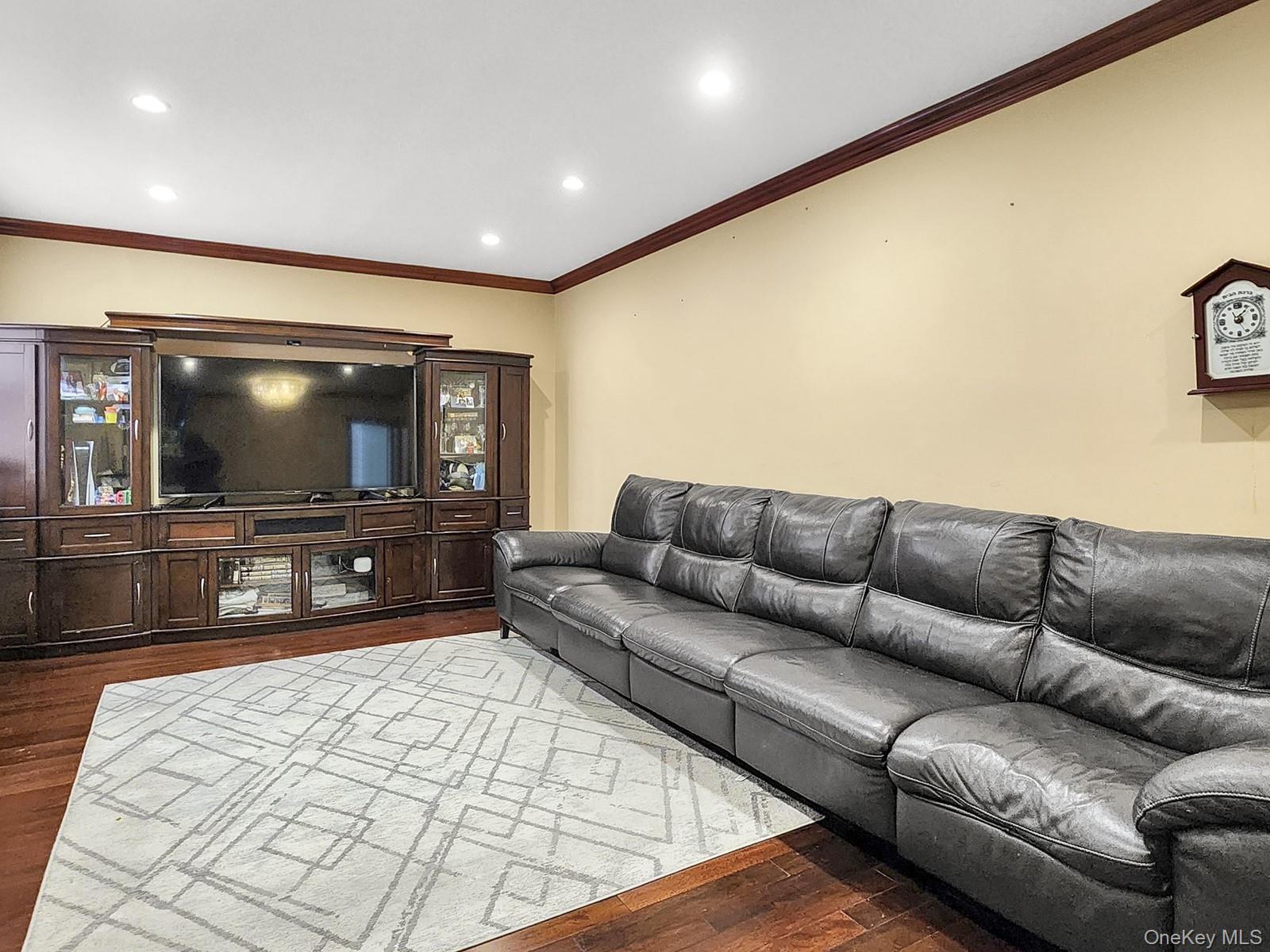 a living room with a couch and a flat screen tv