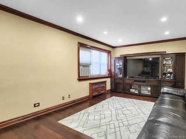 a living room with fireplace furniture and a flat screen tv