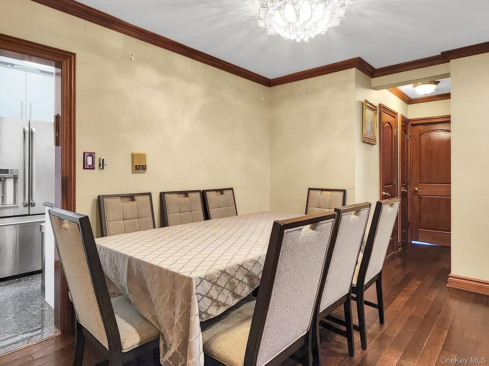 66-10 149th Street, Unit 1A Queens, NY 11367 - Photo 3 of 10 a view of a dining room with furniture and wooden floor