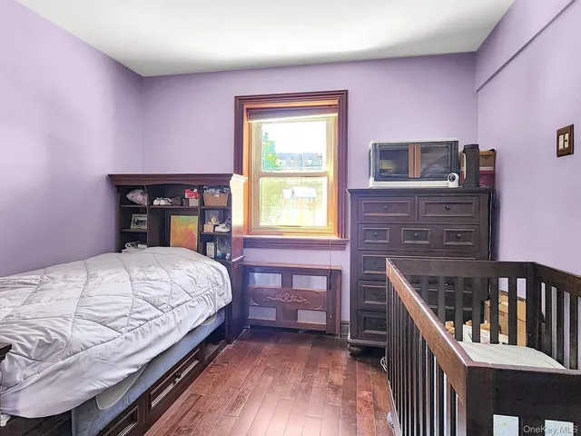 a bedroom with a bed and a table