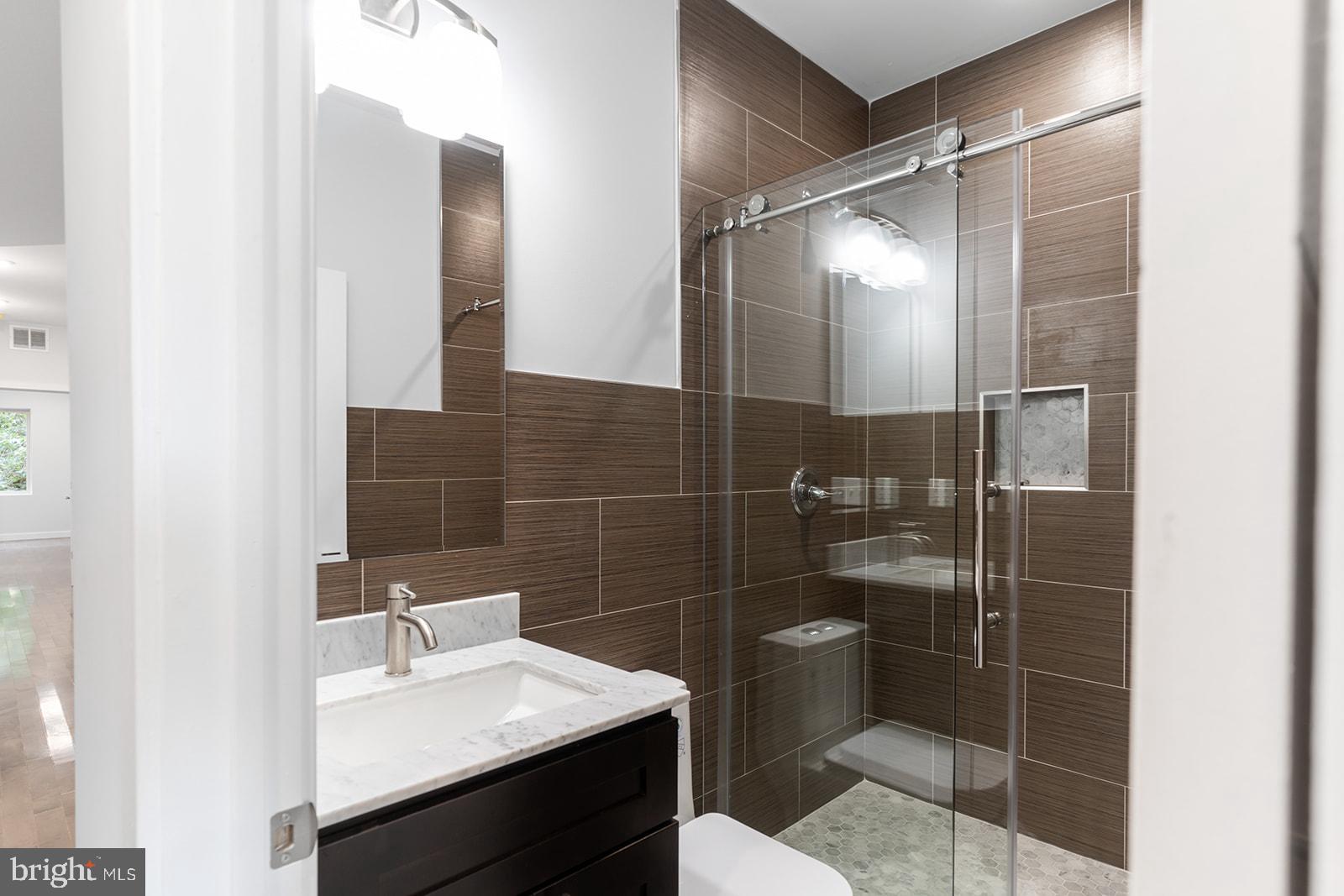 1947 North 7th Street, Unit 2 Philadelphia, PA 19122 - Photo 11 of 31 a bathroom with a sink toilet and shower