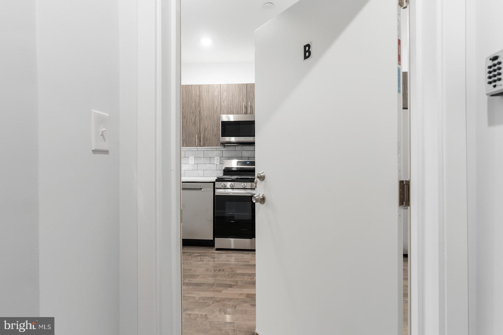1947 North 7th Street, Unit 2 Philadelphia, PA 19122 - Photo 2 of 31 a view of a kitchen from the hallway