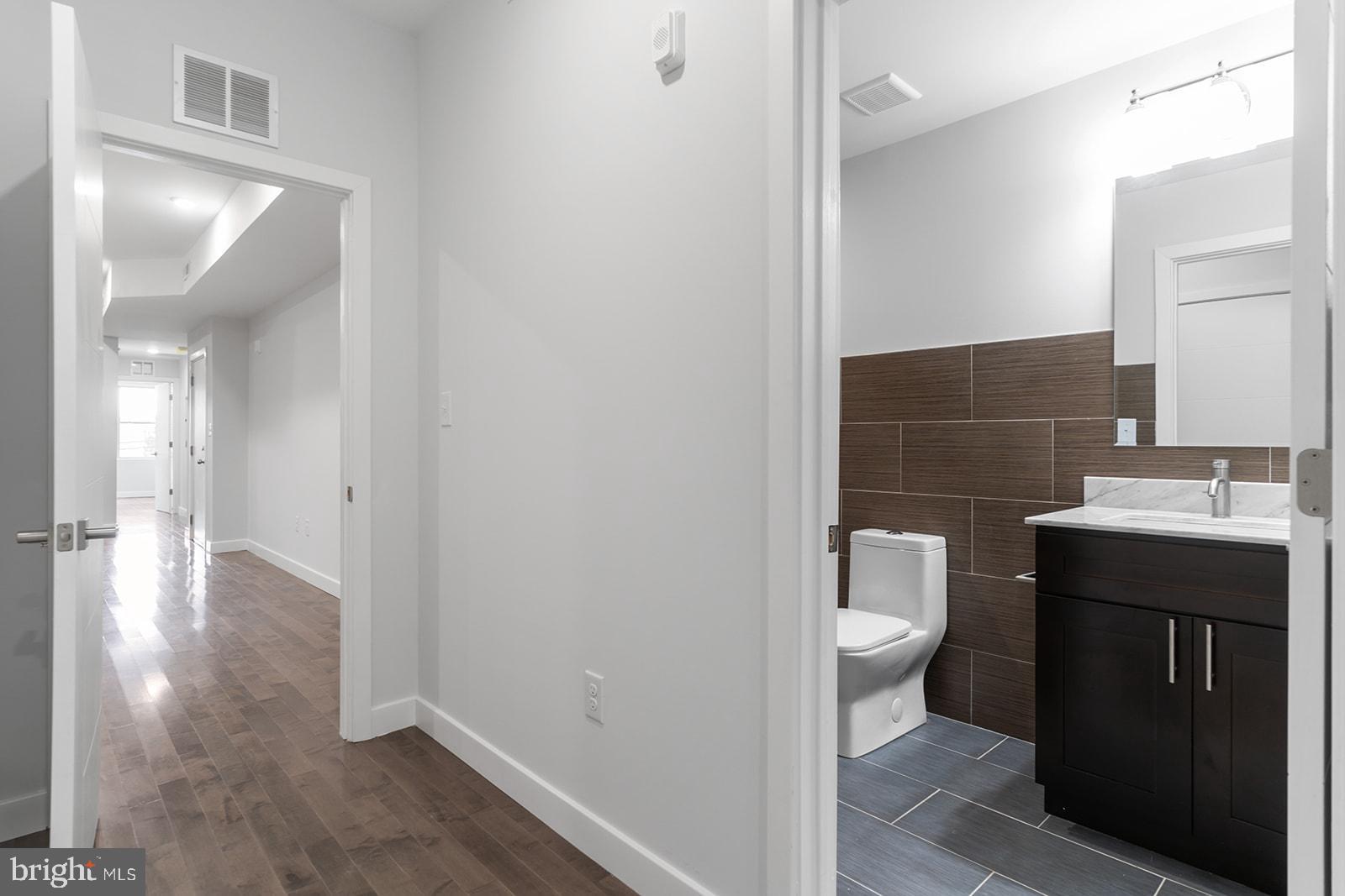1947 North 7th Street, Unit 2 Philadelphia, PA 19122 - Photo 21 of 31 a bathroom with a sink a toilet and shower