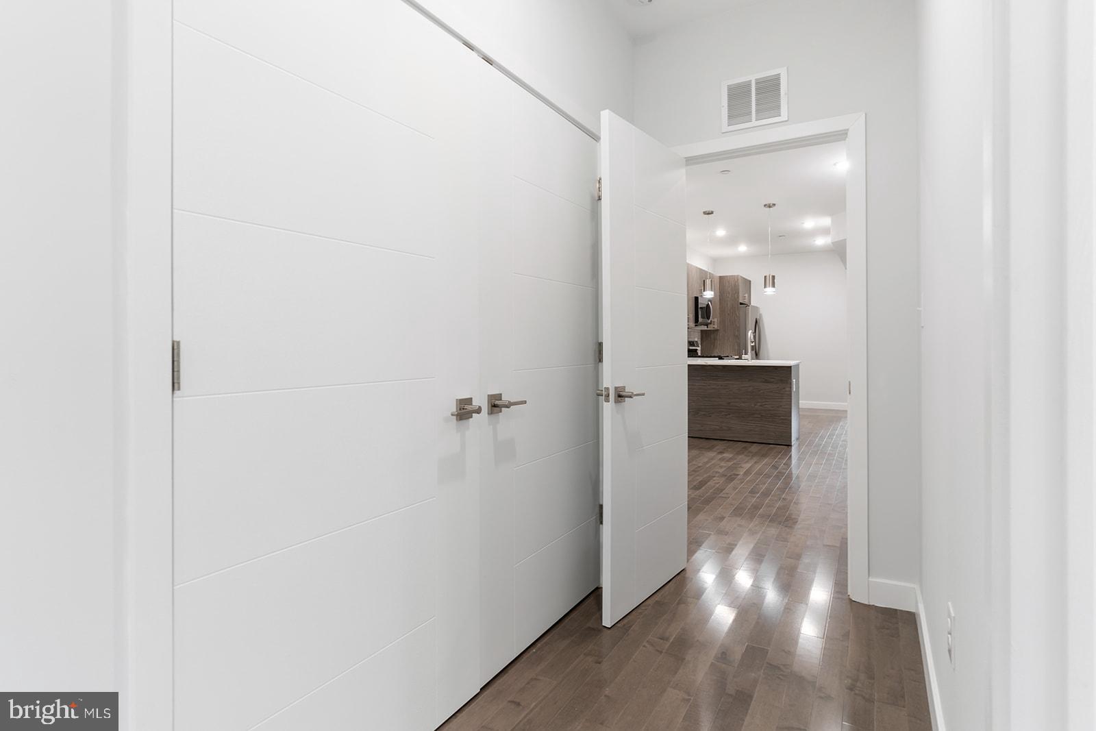 1947 North 7th Street, Unit 2 Philadelphia, PA 19122 - Photo 22 of 31 a view of a hallway with wooden floor