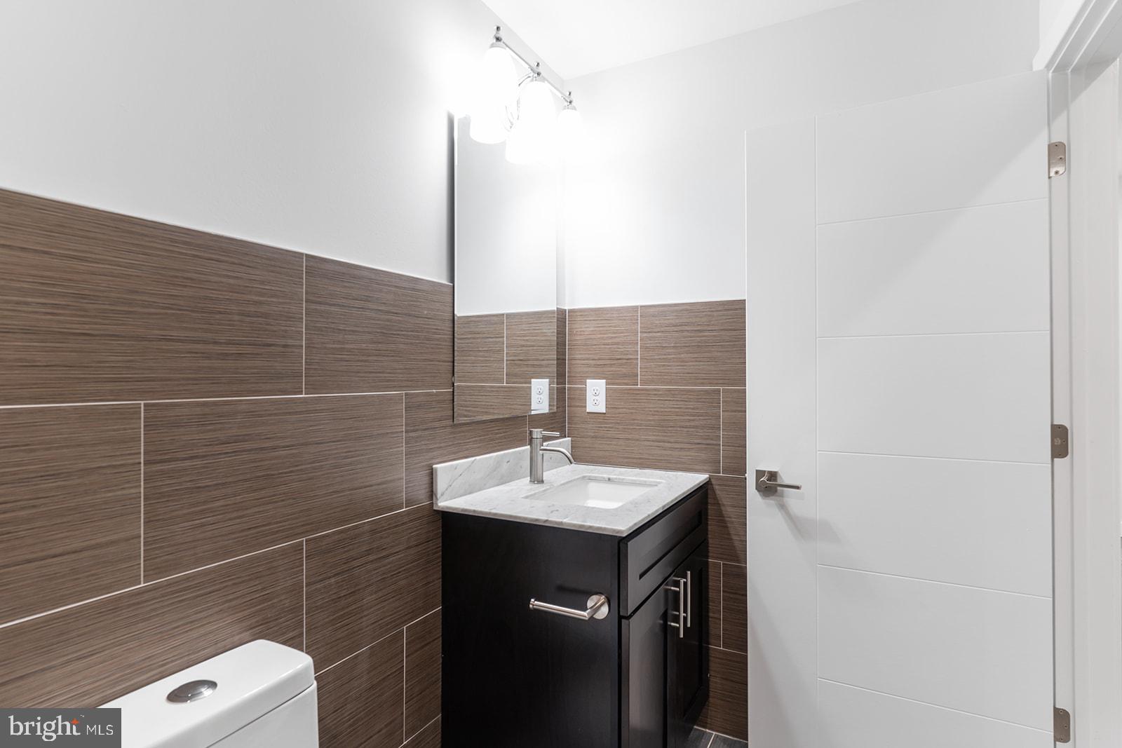 1947 North 7th Street, Unit 2 Philadelphia, PA 19122 - Photo 24 of 31 a bathroom with a sink and a mirror