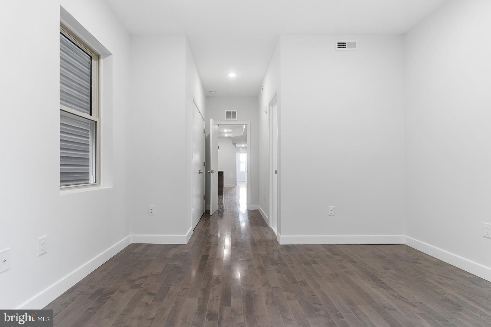 1947 North 7th Street, Unit 2 Philadelphia, PA 19122 - Photo 27 of 31 a view of a room with wooden floor and window