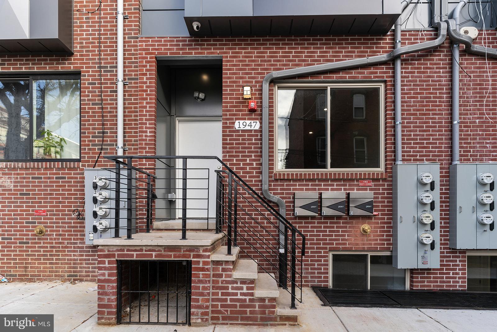 1947 North 7th Street, Unit 2 Philadelphia, PA 19122 - Photo 29 of 31 a view of a brick house with a large window