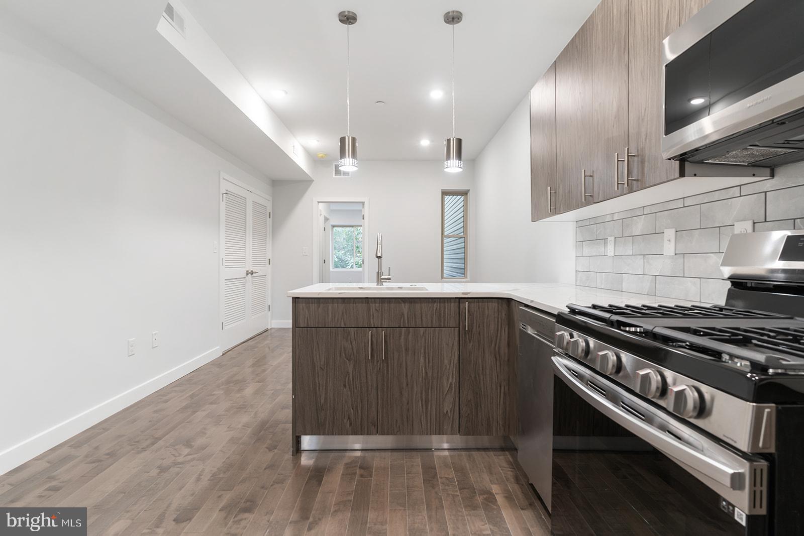 1947 North 7th Street, Unit 2 Philadelphia, PA 19122 - Photo 6 of 31 a kitchen with a stove and a sink