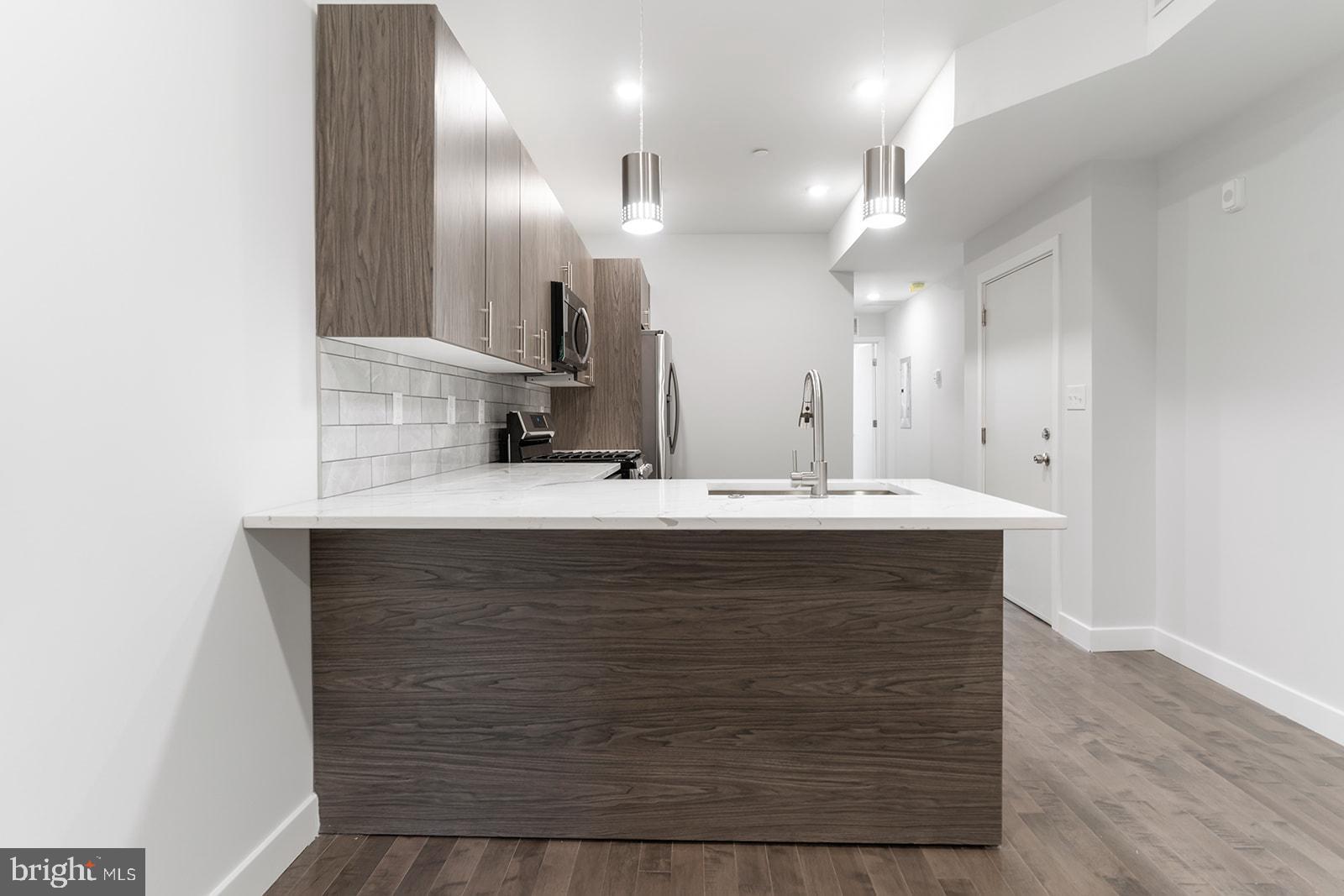 1947 North 7th Street, Unit 2 Philadelphia, PA 19122 - Photo 8 of 31 a bathroom with a sink double vanity and a mirror