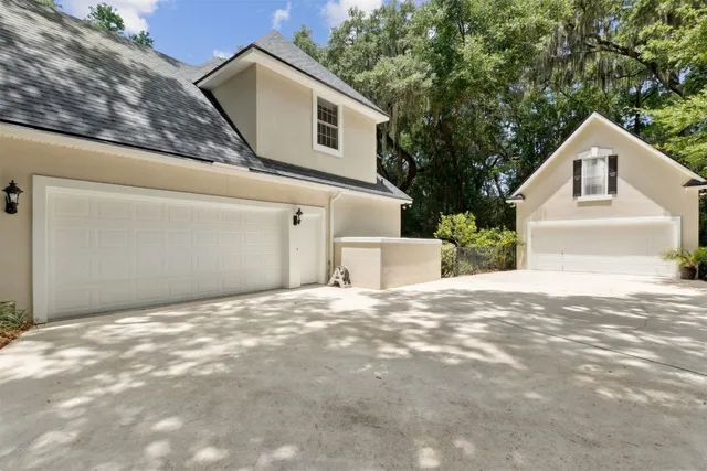 a bedroom with a bed dresser and a window