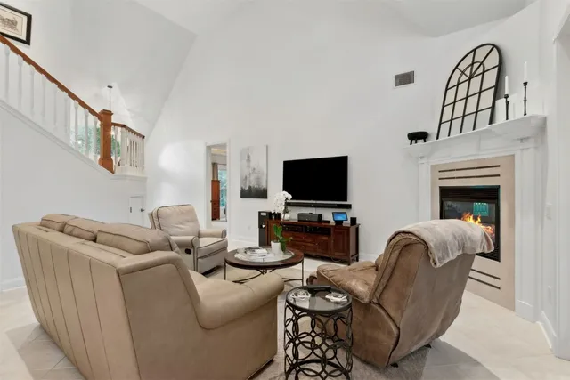 a view of a porch with a floor to ceiling windows and a table