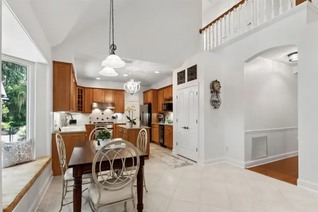a front view of a house with a yard garage and outdoor seating