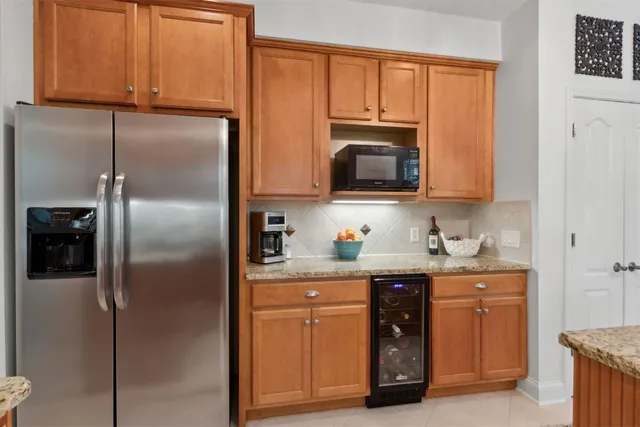 a view of a backyard with table and chairs and potted plants