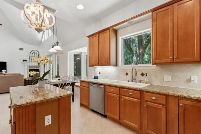 a view of a forest with trees in the background