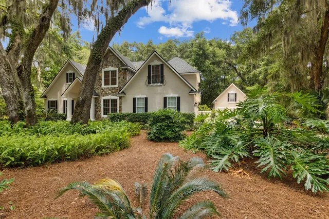 a kitchen with stainless steel appliances granite countertop a refrigerator a stove and a microwave