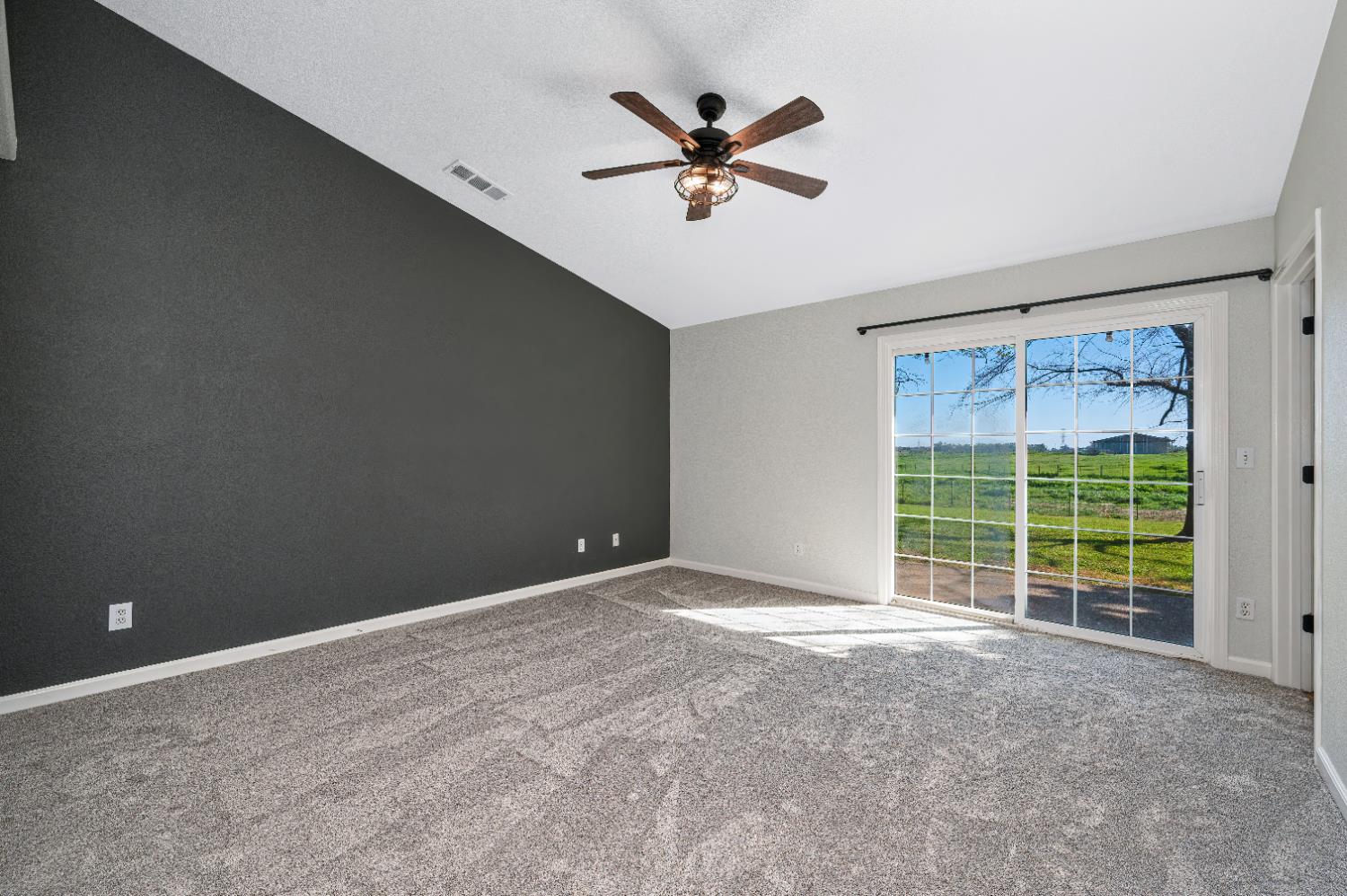 12260 Angle Road Herald, CA 95638 - Photo 13 of 43 a view of a livingroom with a ceiling fan and a window