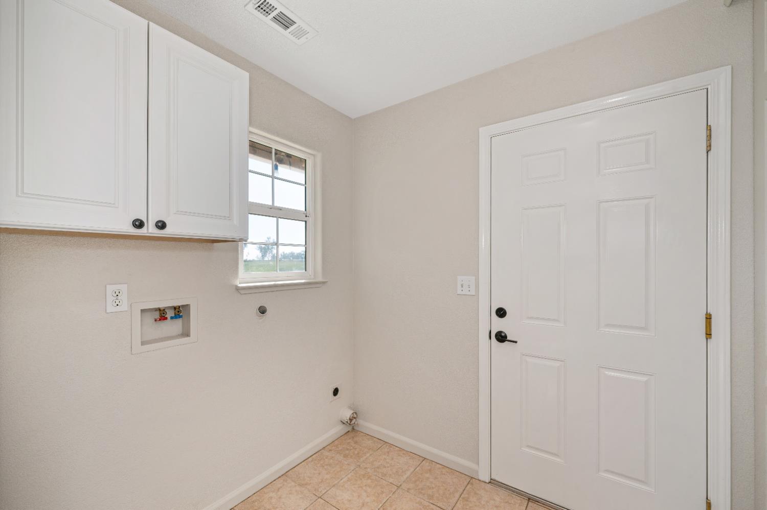 12260 Angle Road Herald, CA 95638 - Photo 17 of 43 a view of cabinets and window