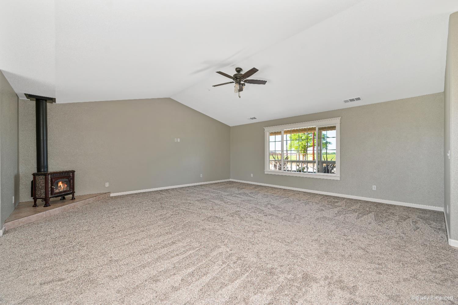 12260 Angle Road Herald, CA 95638 - Photo 19 of 43 an empty room with windows and chandelier fan