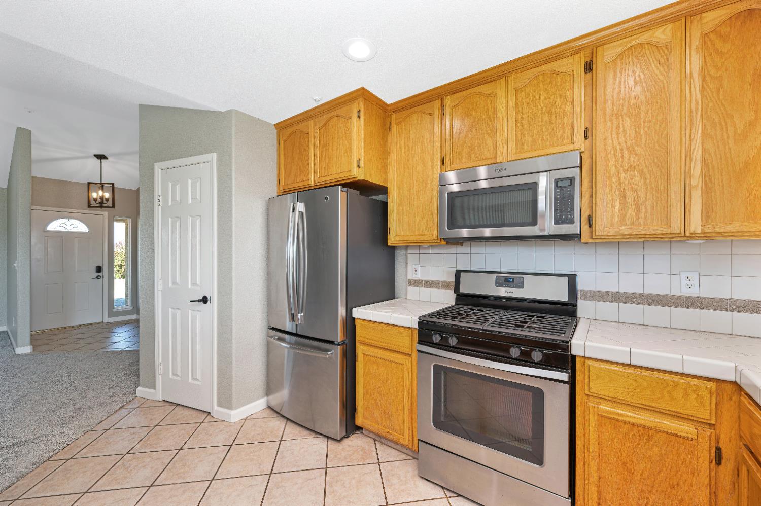 12260 Angle Road Herald, CA 95638 - Photo 8 of 43 a kitchen with stainless steel appliances granite countertop a refrigerator stove and microwave