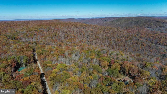 a view of a room with an ocean and mountain view
