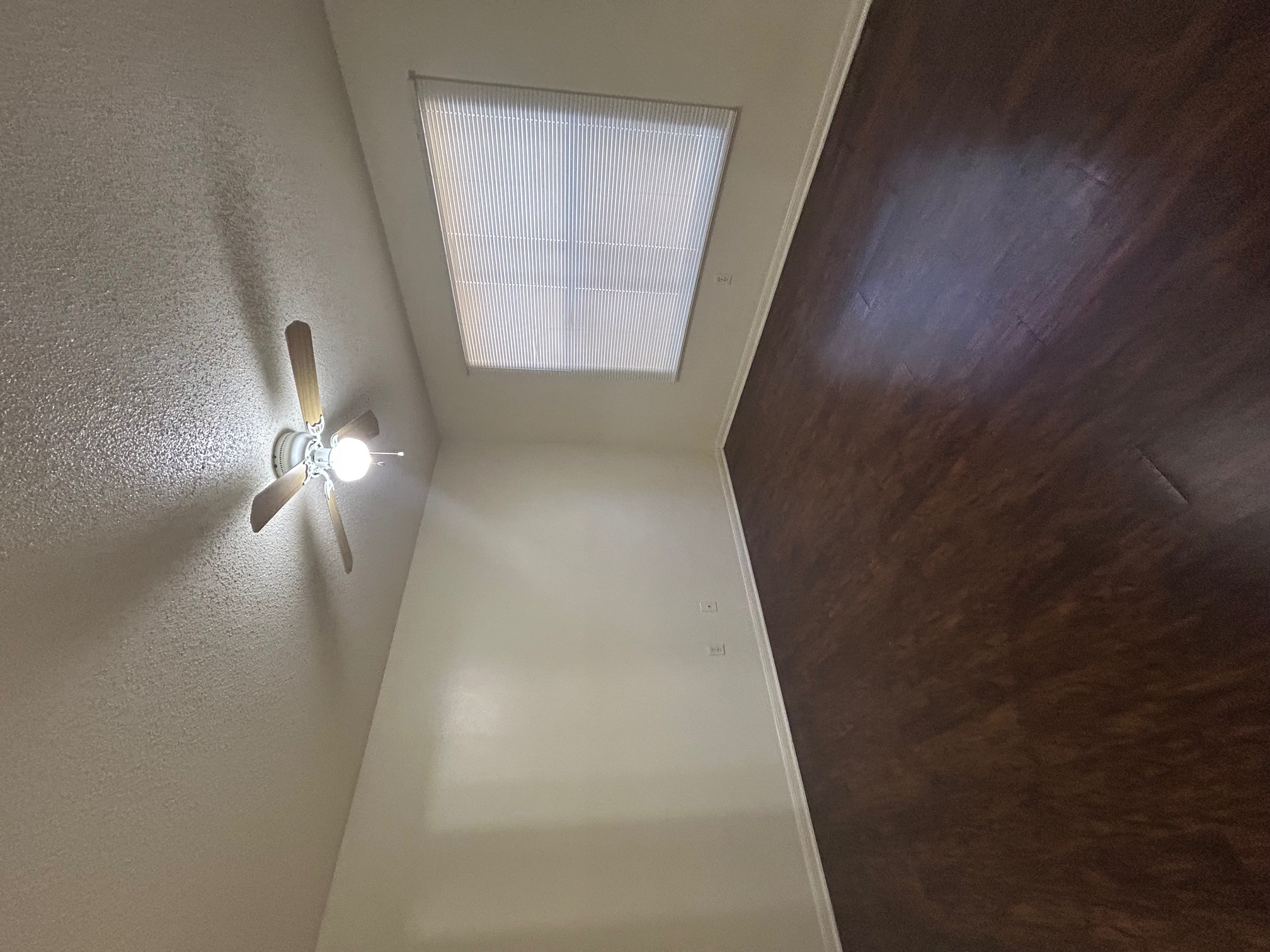8812 Schick Road, Unit C Austin, TX 78729 - Photo 10 of 12 Spare room with dark wood-style flooring, a textured ceiling, and ceiling fan