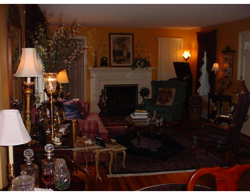 191 Overlook Drive Springfield, MA 01118 - Photo 9 of 12 a living room with furniture a lamp and a fireplace