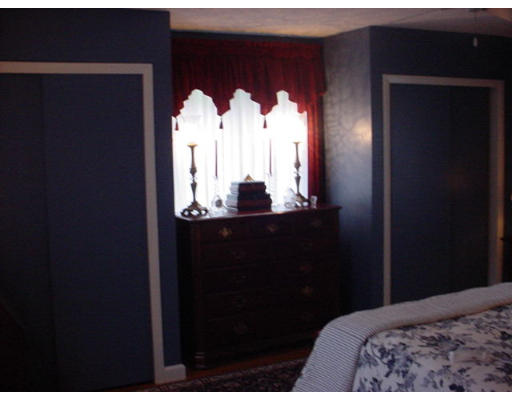 191 Overlook Drive Springfield, MA 01118 - Photo 10 of 12 a bedroom with a bed and a mirror