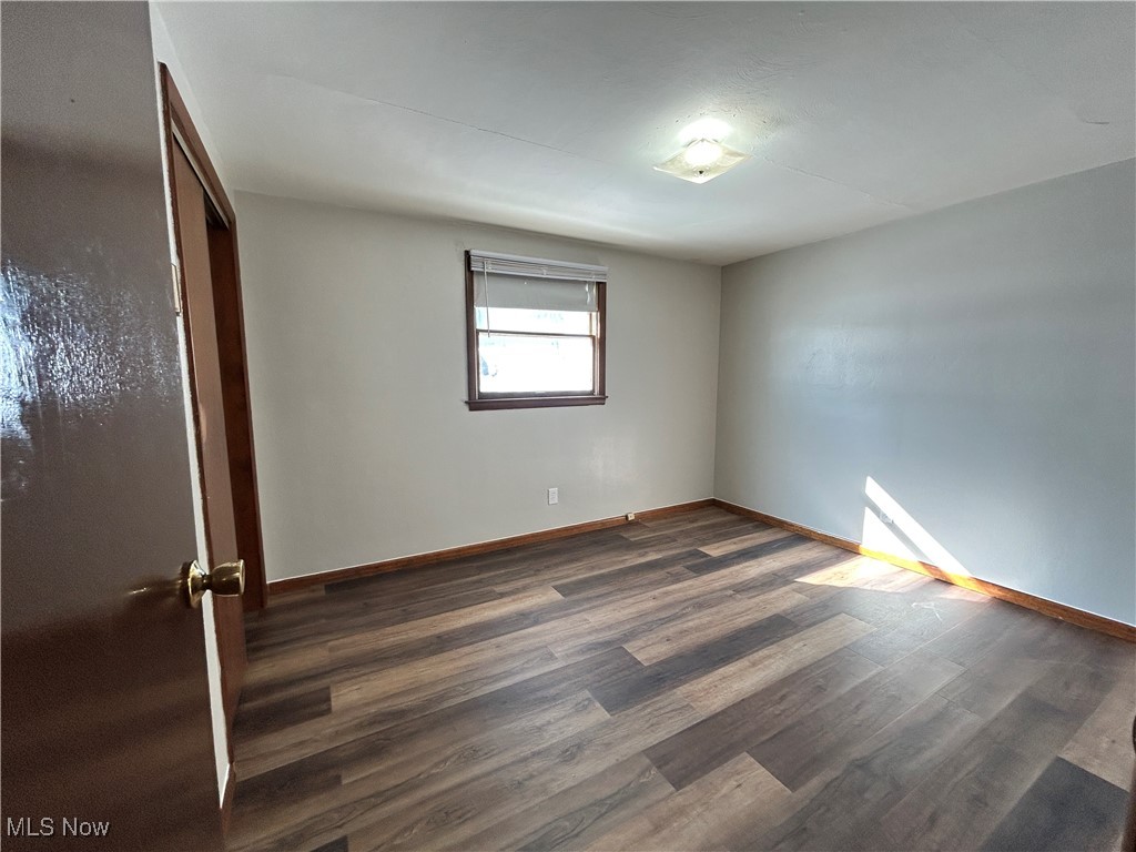 98 View Street, Unit 2 Weirton, WV 26062 - Photo 7 of 10 Unfurnished bedroom featuring a closet and dark wood-style floors