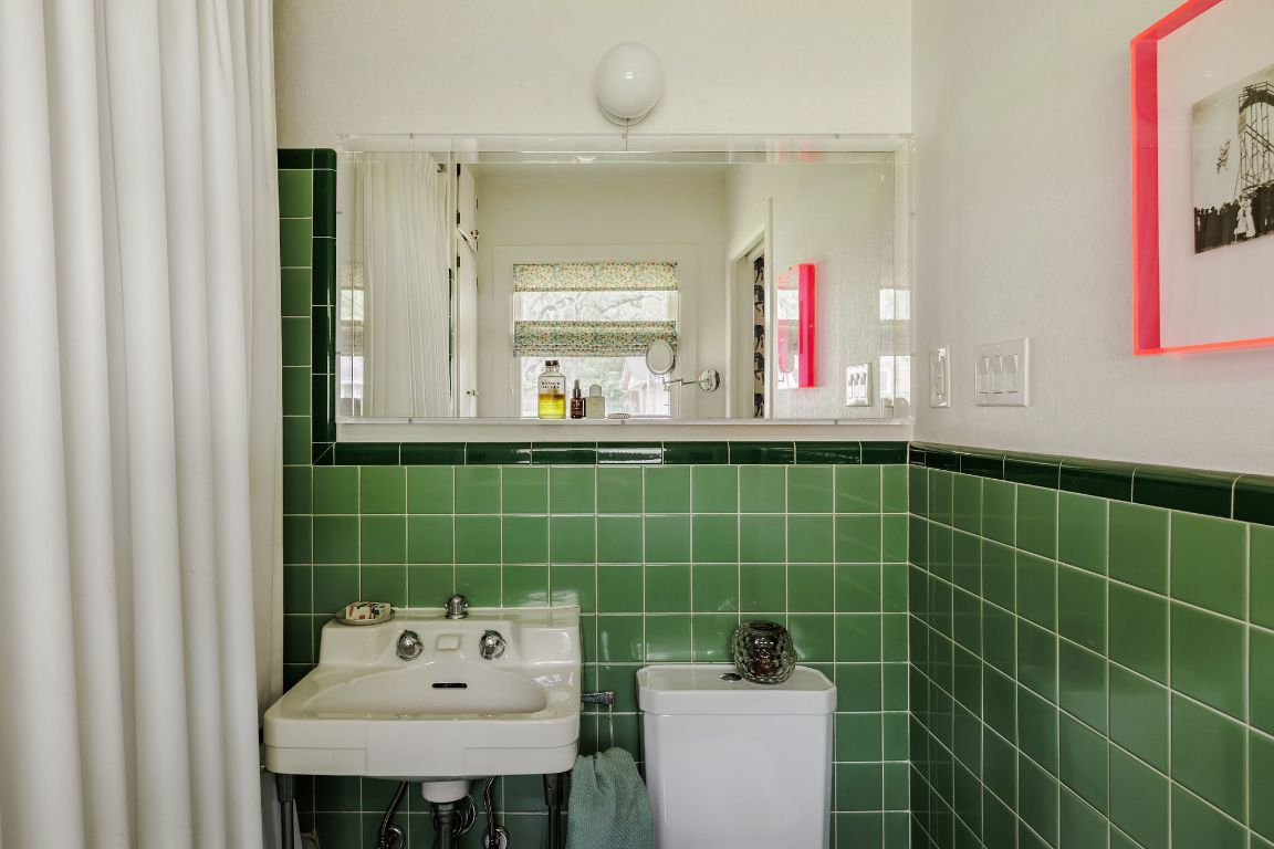 4201 Gregg Ward Lane Austin, TX 78744 - Photo 13 of 40 a bathroom with a sink mirror and toilet