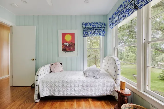 a bathroom with a sink a toilet and shower curtain