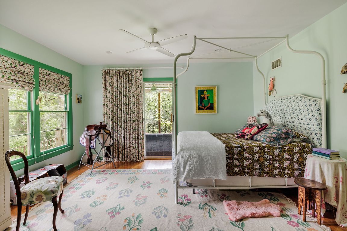 4201 Gregg Ward Lane Austin, TX 78744 - Photo 17 of 40 a bed room with a bed and a chair