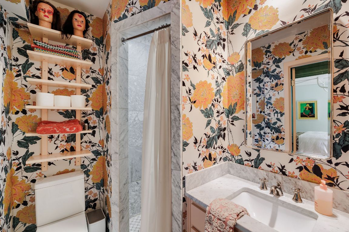 4201 Gregg Ward Lane Austin, TX 78744 - Photo 19 of 40 a bathroom with a sink toilet and shower curtain