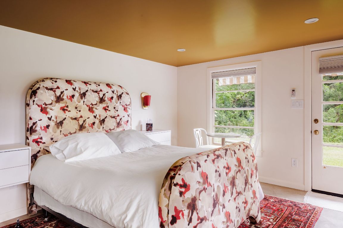 4201 Gregg Ward Lane Austin, TX 78744 - Photo 22 of 40 a bedroom with a large window and a bed