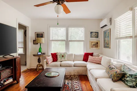 a living room with furniture and a flat screen tv