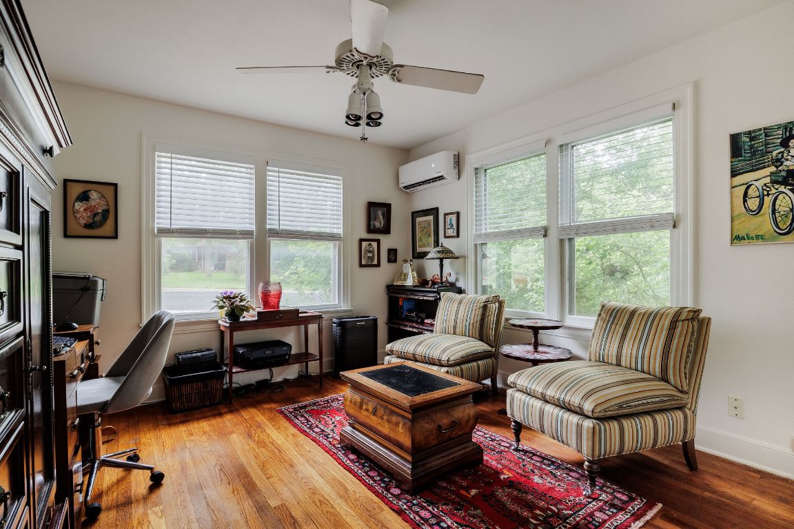 4201 Gregg Ward Lane Austin, TX 78744 - Photo 35 of 40 a living room with furniture fireplace and a large window