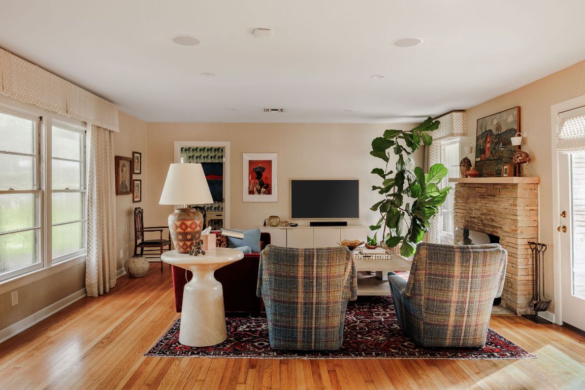4201 Gregg Ward Lane Austin, TX 78744 - Photo 5 of 40 a dining room with furniture a flat screen tv and a window